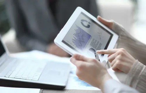 financial graphs on a tablet