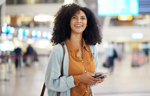 Woman happy laughing at airport